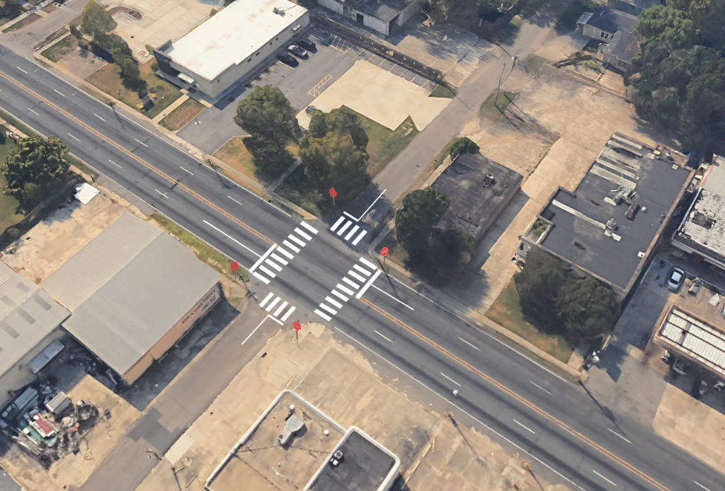 The previous image is overlayed with a digital illustration of crosswalks and stop signs, enhancing pedestrian safety and comfort