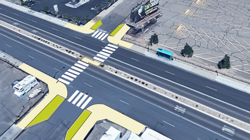 Bump outs and well-lit crosswalks help reclaim space for people to walk safely across a wide street.