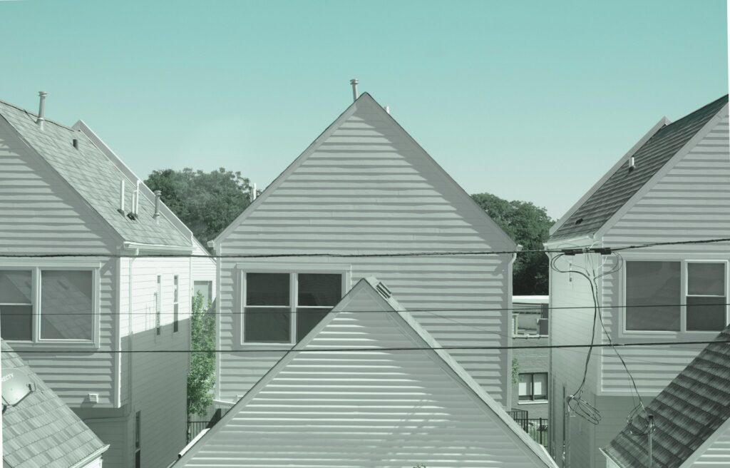 A row of identical houses in a suburban neighborhood
